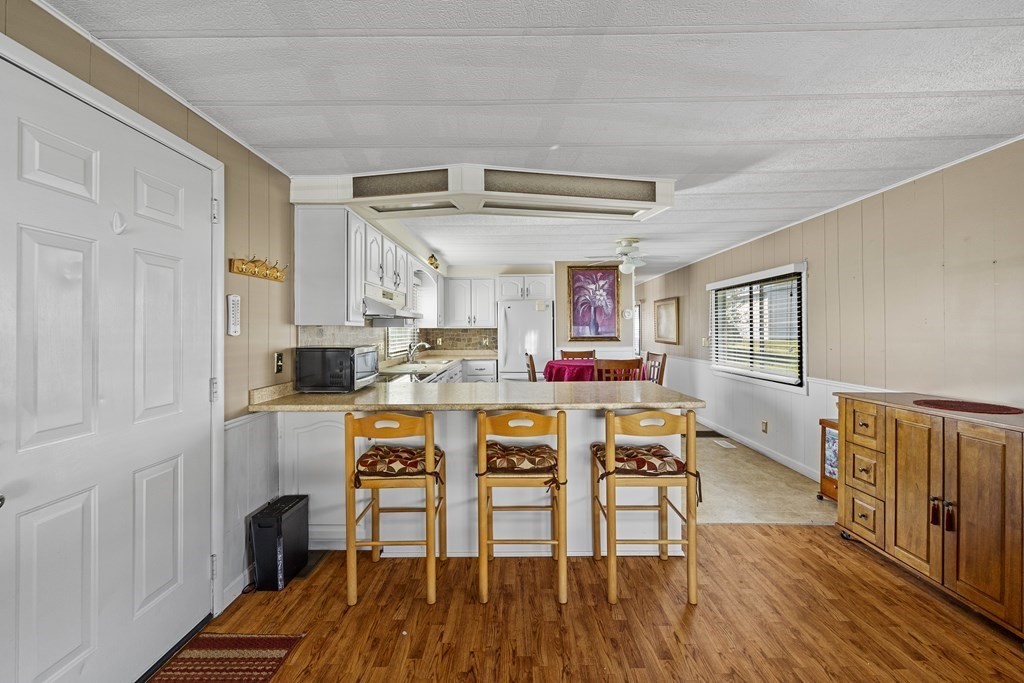 102 Peter Street Raynham, MA 02767 - Photo 6 of 23 a living room with furniture and a wooden floor