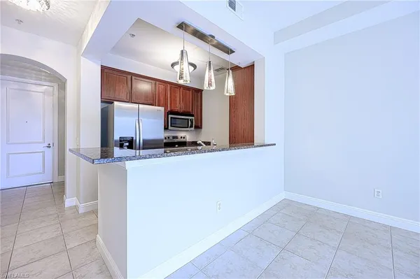 a kitchen with a sink cabinets and appliances