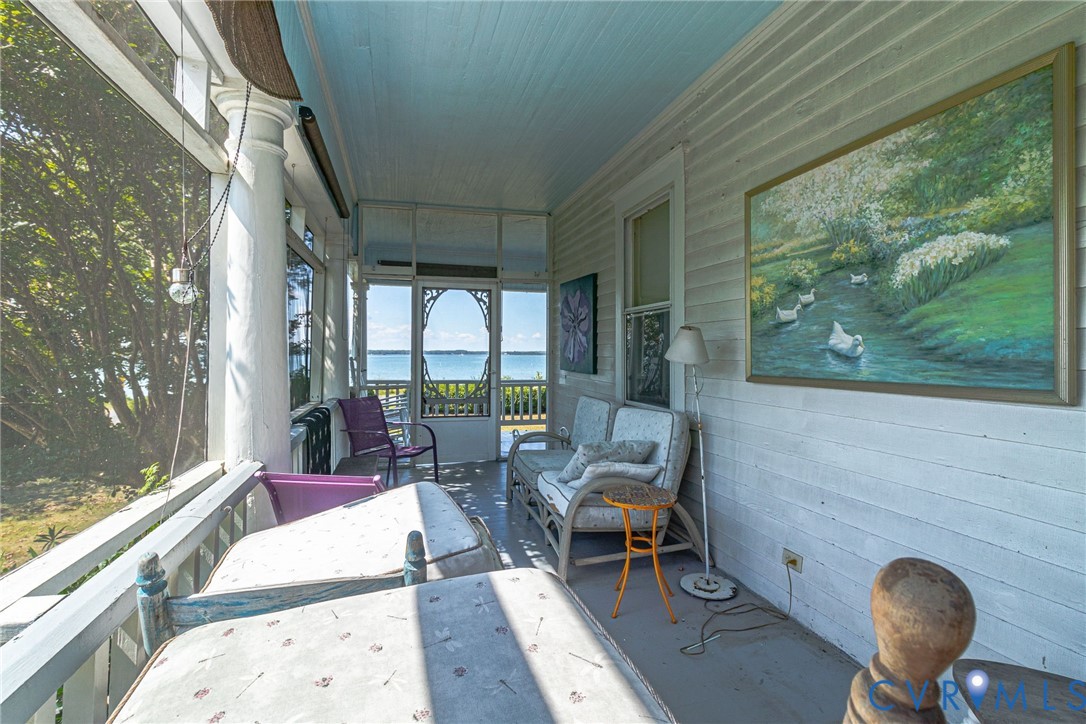 218 Fleeton Point Circle Reedville, VA 22539 - Photo 13 of 43 Sunroom / solarium featuring a water view