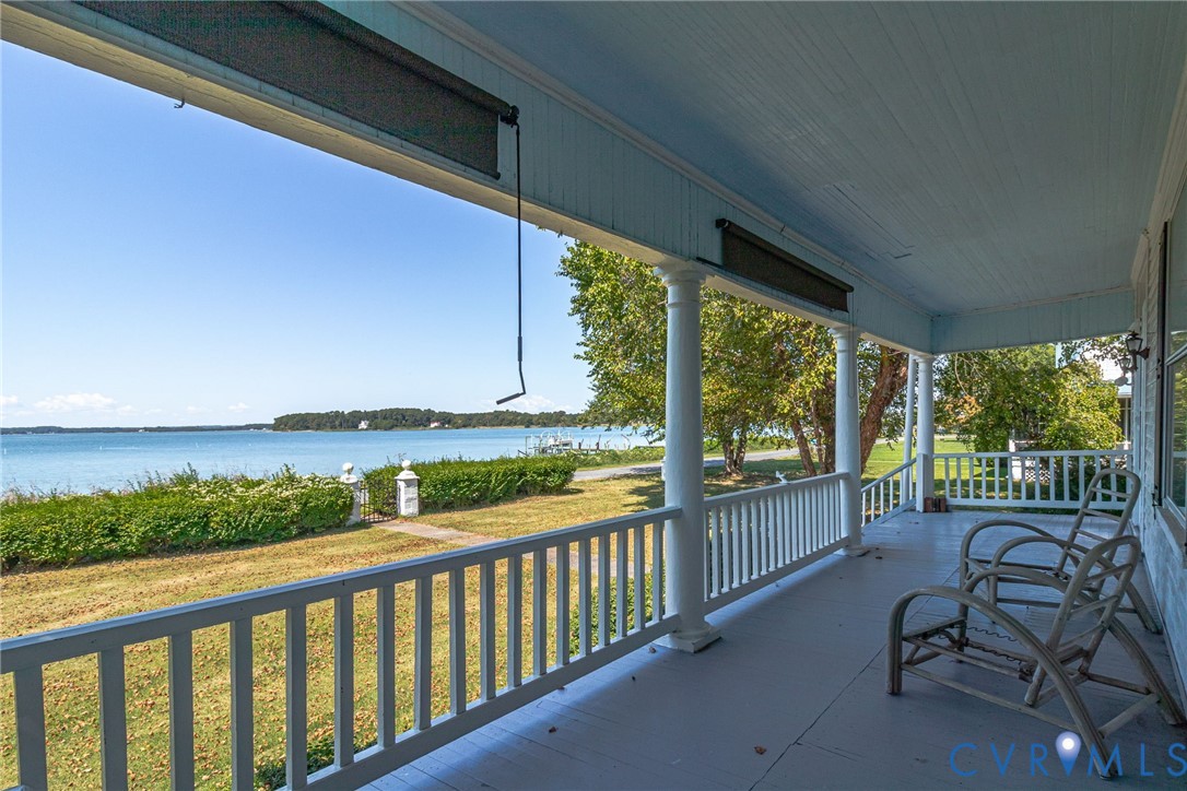 218 Fleeton Point Circle Reedville, VA 22539 - Photo 14 of 43 Covered porch featuring a water view