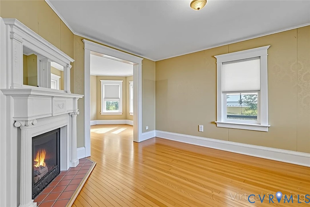 218 Fleeton Point Circle Reedville, VA 22539 - Photo 19 of 43 Unfurnished living room with light wood-style floo