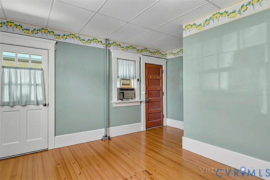 218 Fleeton Point Circle Reedville, VA 22539 - Photo 24 of 43 Spare room featuring wood-type flooring and a pane