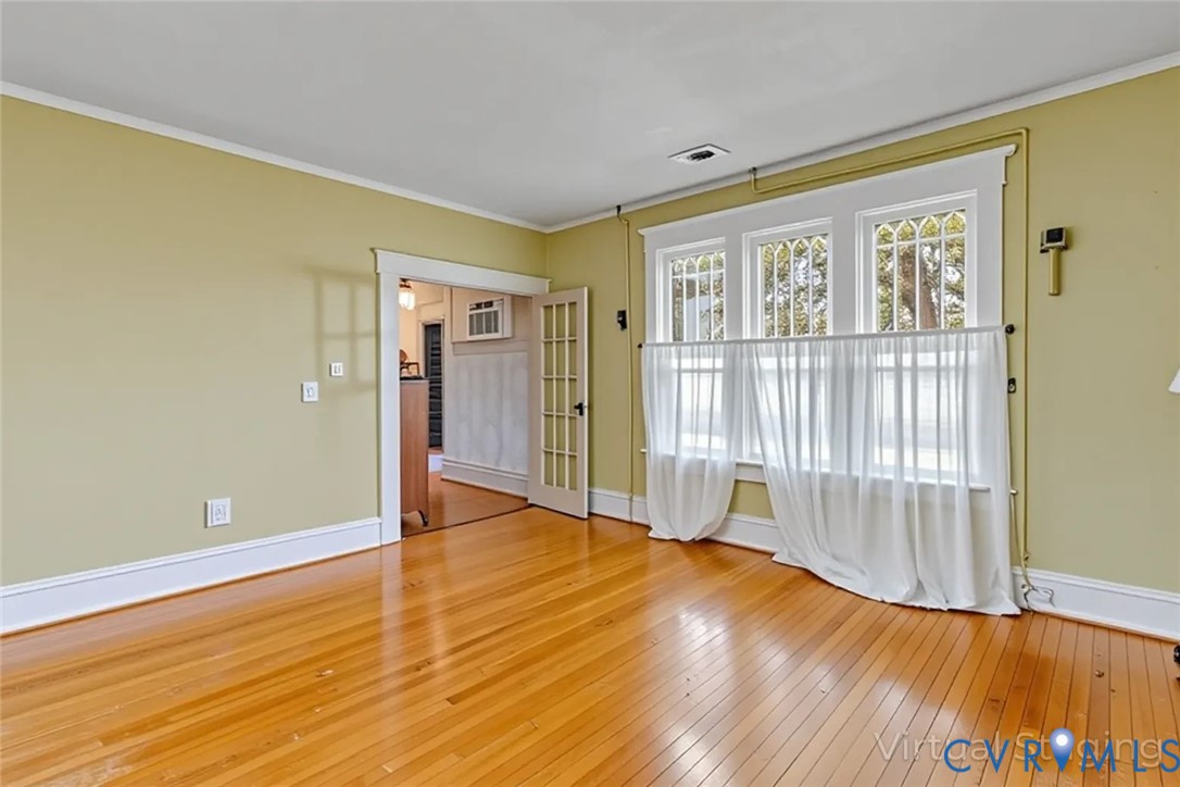 218 Fleeton Point Circle Reedville, VA 22539 - Photo 25 of 43 Unfurnished room with ornamental molding, light wo