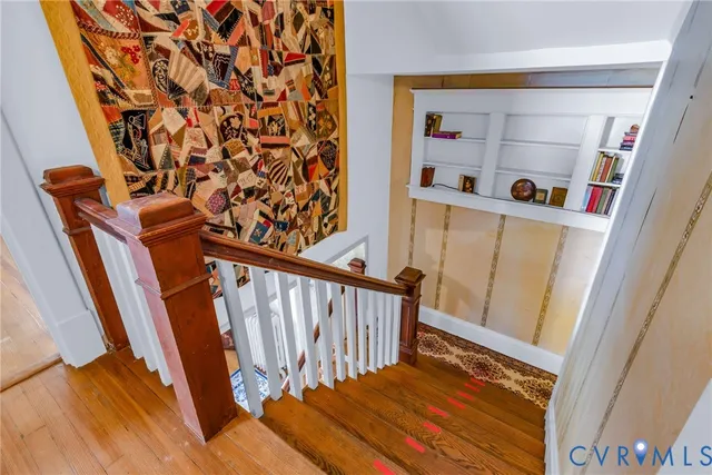 a view of entryway with wooden floor and stairs