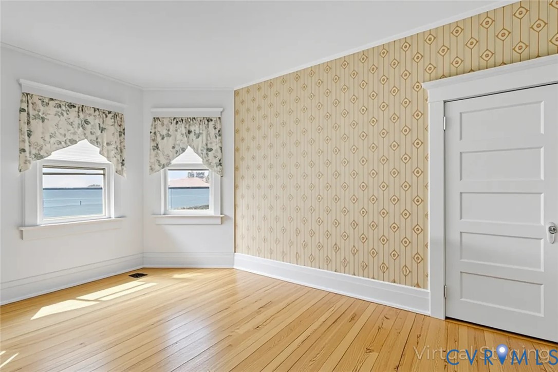 218 Fleeton Point Circle Reedville, VA 22539 - Photo 32 of 43 Empty room featuring hardwood / wood-style floorin