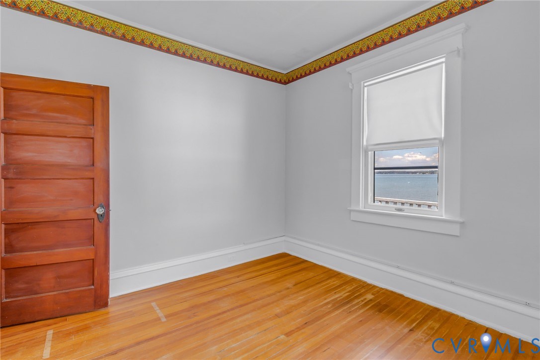 218 Fleeton Point Circle Reedville, VA 22539 - Photo 34 of 43 Spare room featuring baseboards and light wood fin