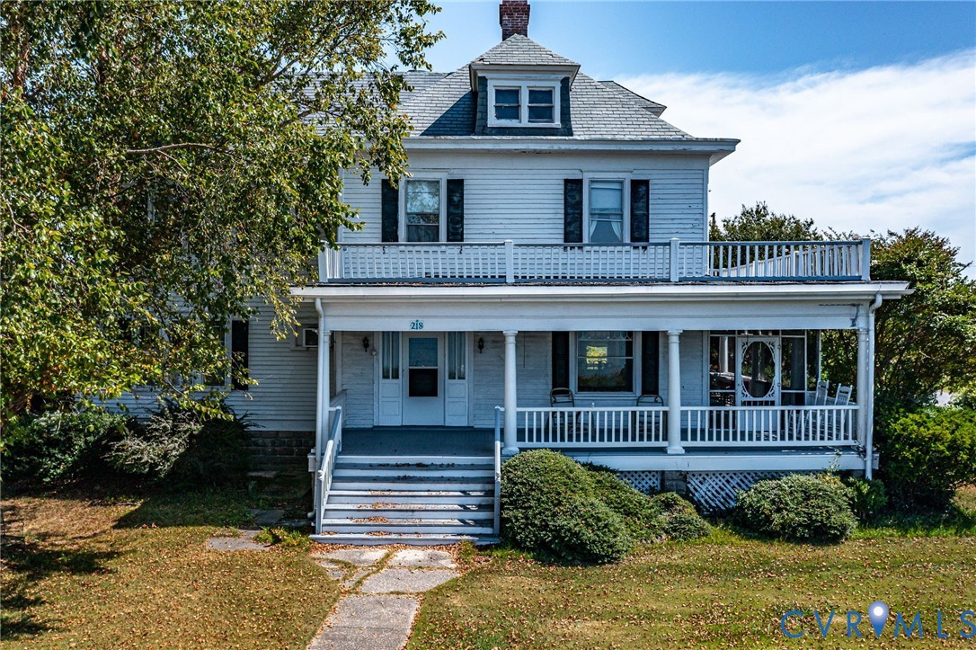 218 Fleeton Point Circle Reedville, VA 22539 - Photo 8 of 43 American foursquare style home with a chimney, a f