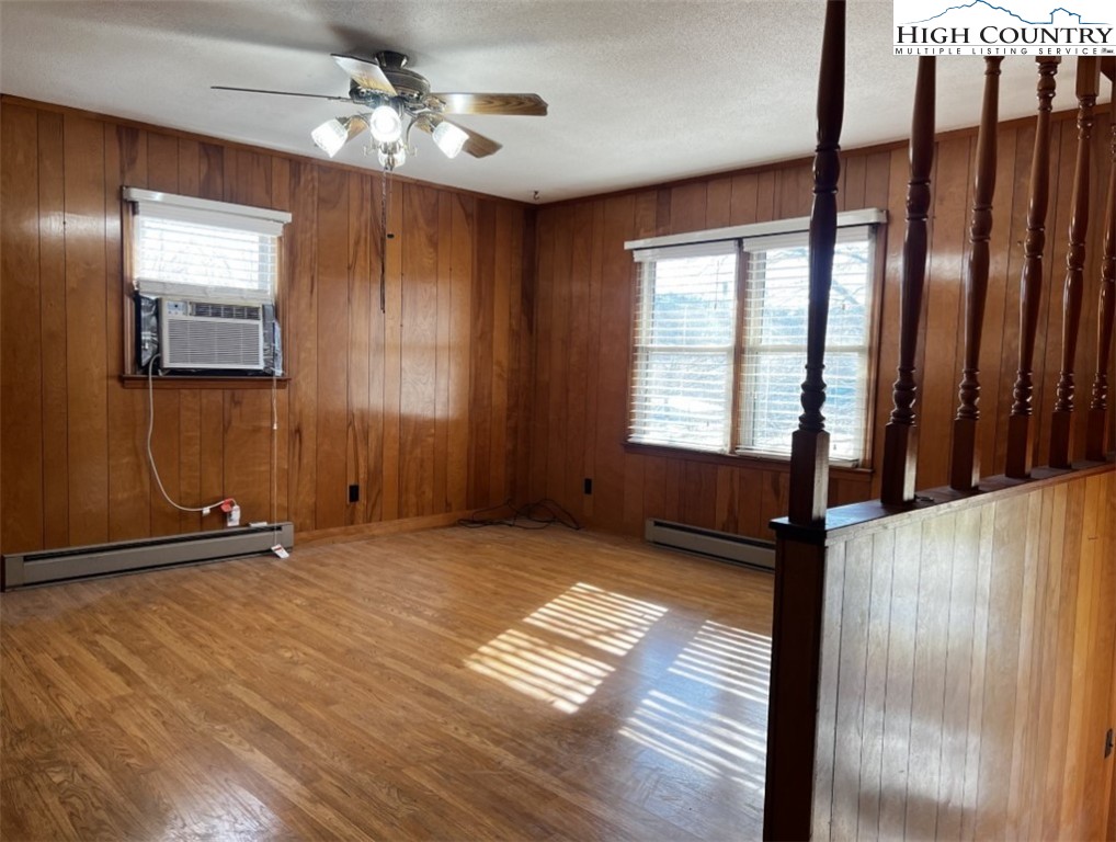 610 Collins Road Sparta, NC 28675 - Photo 12 of 22 a view of an empty room with window and wooden floor