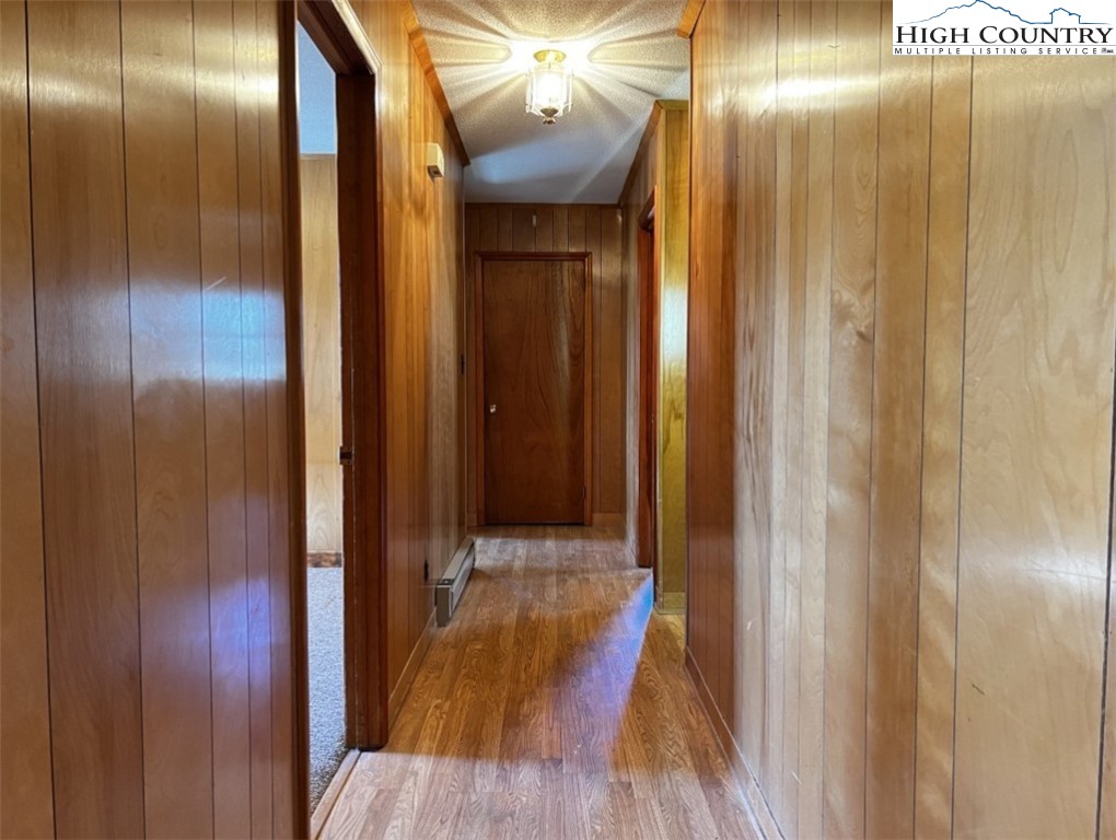 610 Collins Road Sparta, NC 28675 - Photo 16 of 22 a view of a hallway with wooden floor