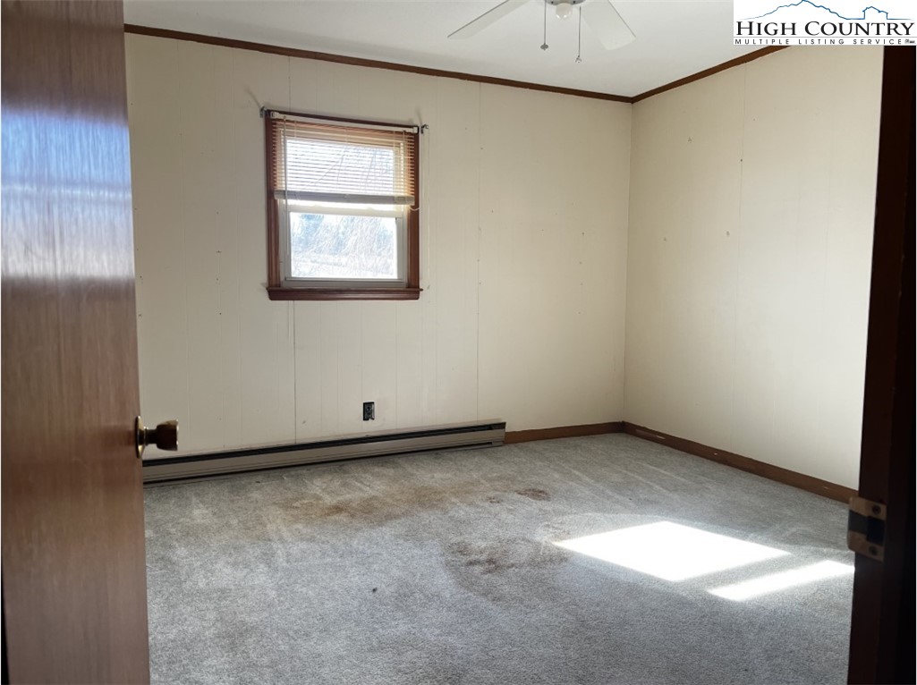 610 Collins Road Sparta, NC 28675 - Photo 17 of 22 a view of an empty room with a window