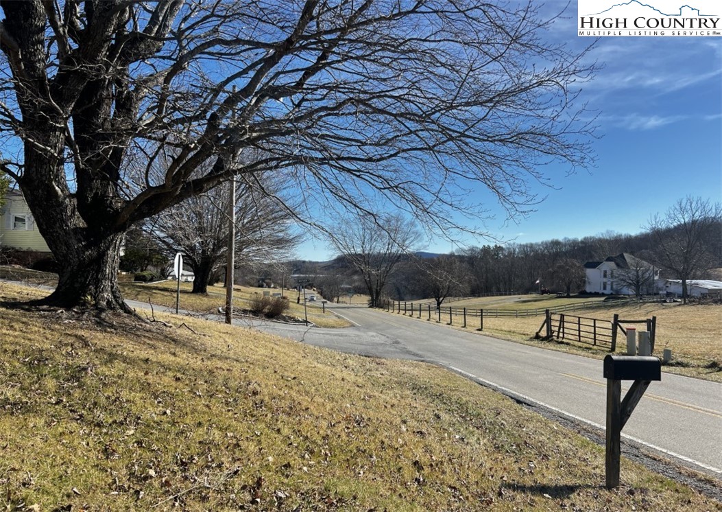 610 Collins Road Sparta, NC 28675 - Photo 3 of 22 a view of a yard with wooden fence