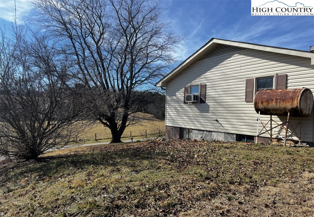 610 Collins Road Sparta, NC 28675 - Photo 4 of 22 a front view of a house with garden