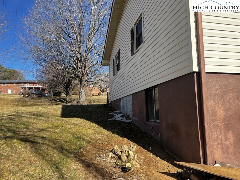 610 Collins Road Sparta, NC 28675 - Photo 6 of 22 a view of a house with a yard