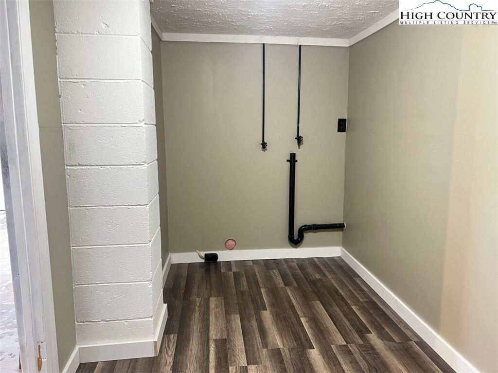 610 Collins Road Sparta, NC 28675 - Photo 8 of 22 a view of a room with wooden floor and a window