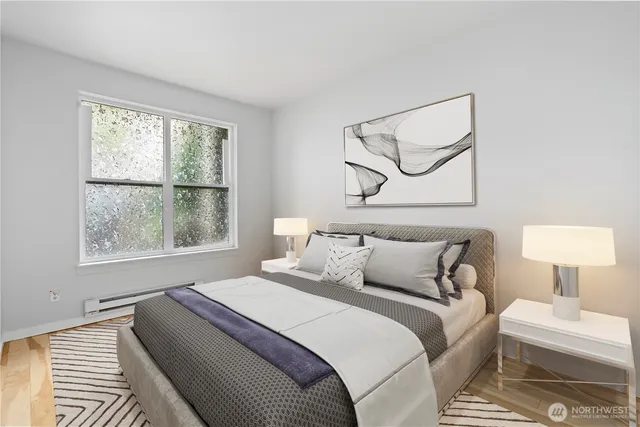 a bedroom with bed and a window