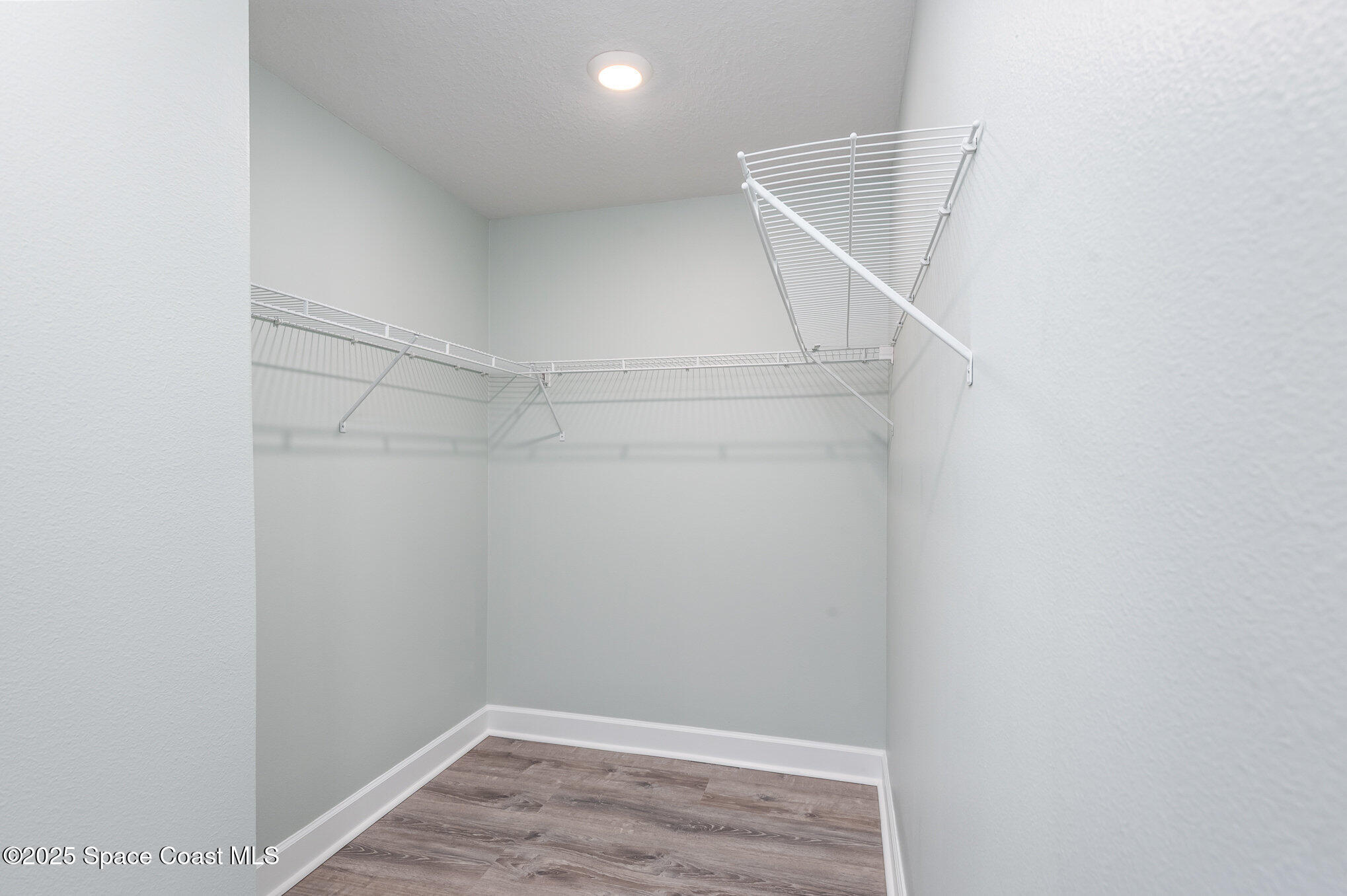 1331 Tupelo Circle Cocoa, FL 32926 - Photo 14 of 29 a view of walk in closet with empty racks