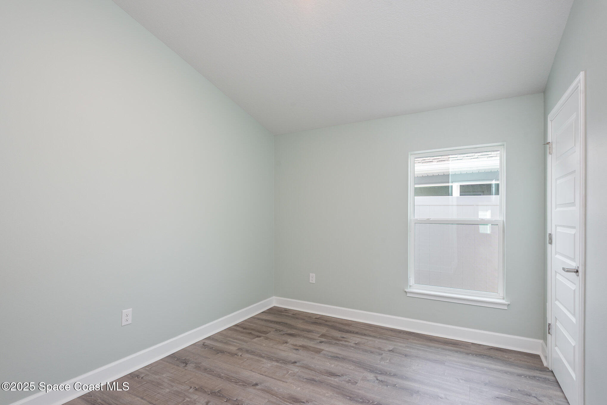 1331 Tupelo Circle Cocoa, FL 32926 - Photo 17 of 29 a view of an empty room with closet and a window