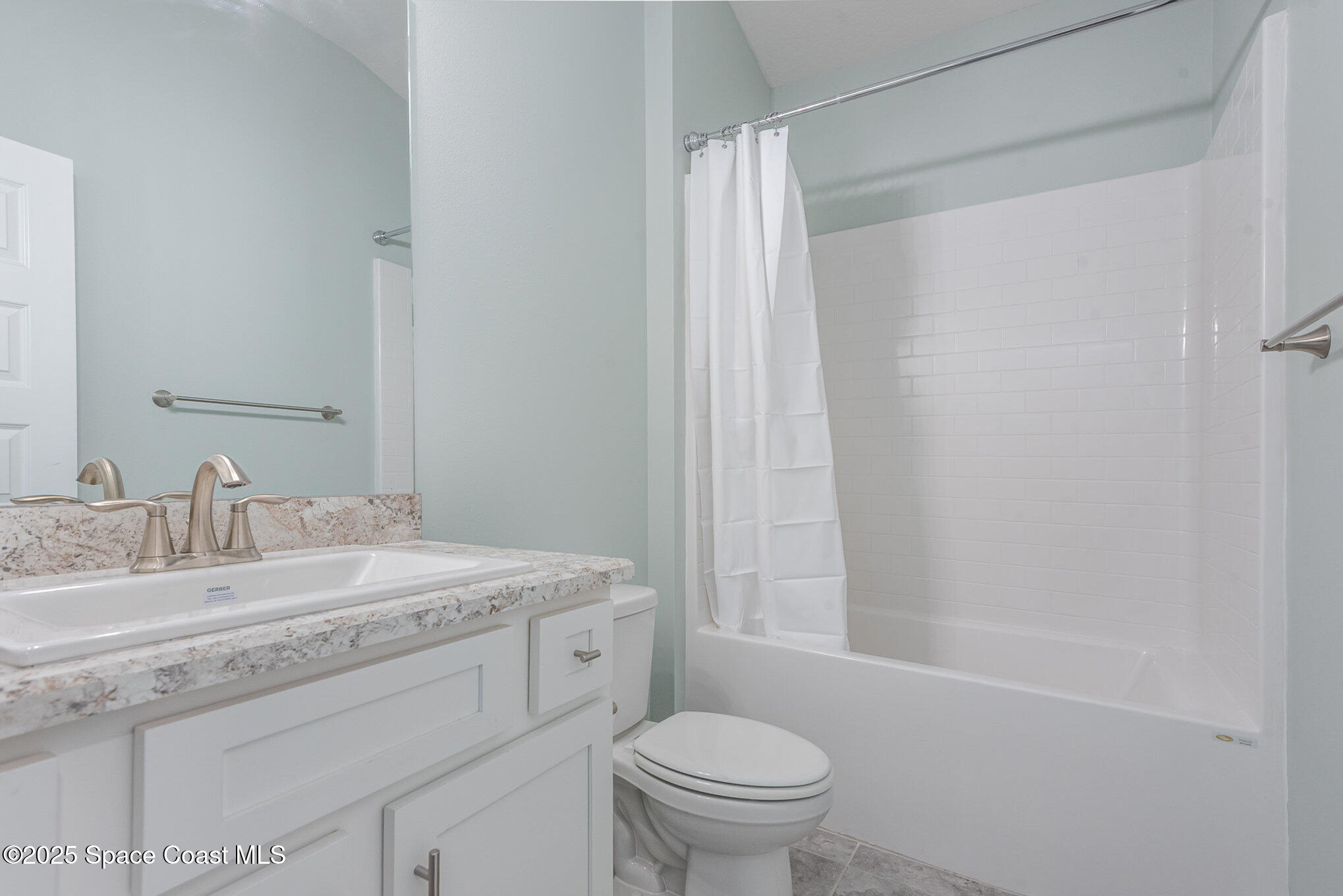 1331 Tupelo Circle Cocoa, FL 32926 - Photo 19 of 29 a bathroom with a granite countertop sink toilet a mirror and shower