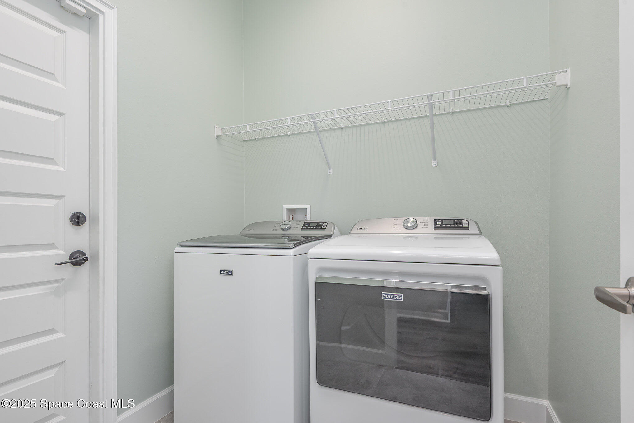 1331 Tupelo Circle Cocoa, FL 32926 - Photo 20 of 29 a utility room with dryer and washer