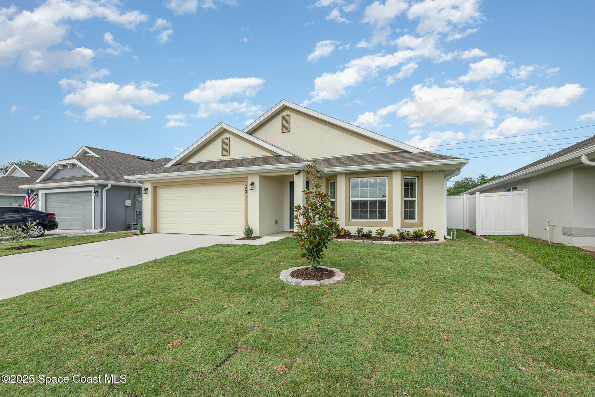 1331 Tupelo Circle Cocoa, FL 32926 - Photo 2 of 29 a front view of a house with a yard and porch