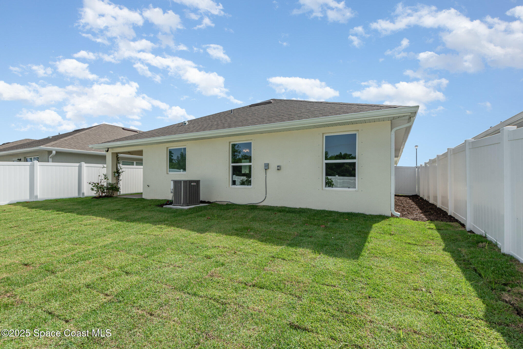 1331 Tupelo Circle Cocoa, FL 32926 - Photo 23 of 29 a view of a backyard with plants and a garden