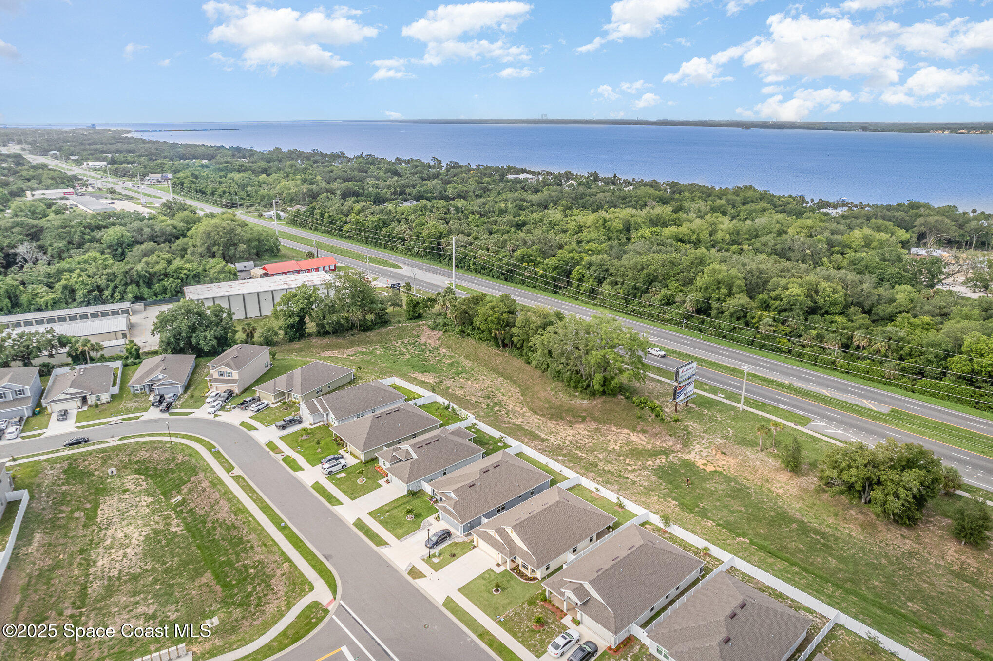 1331 Tupelo Circle Cocoa, FL 32926 - Photo 28 of 29 a view of a swimming pool with a lake view