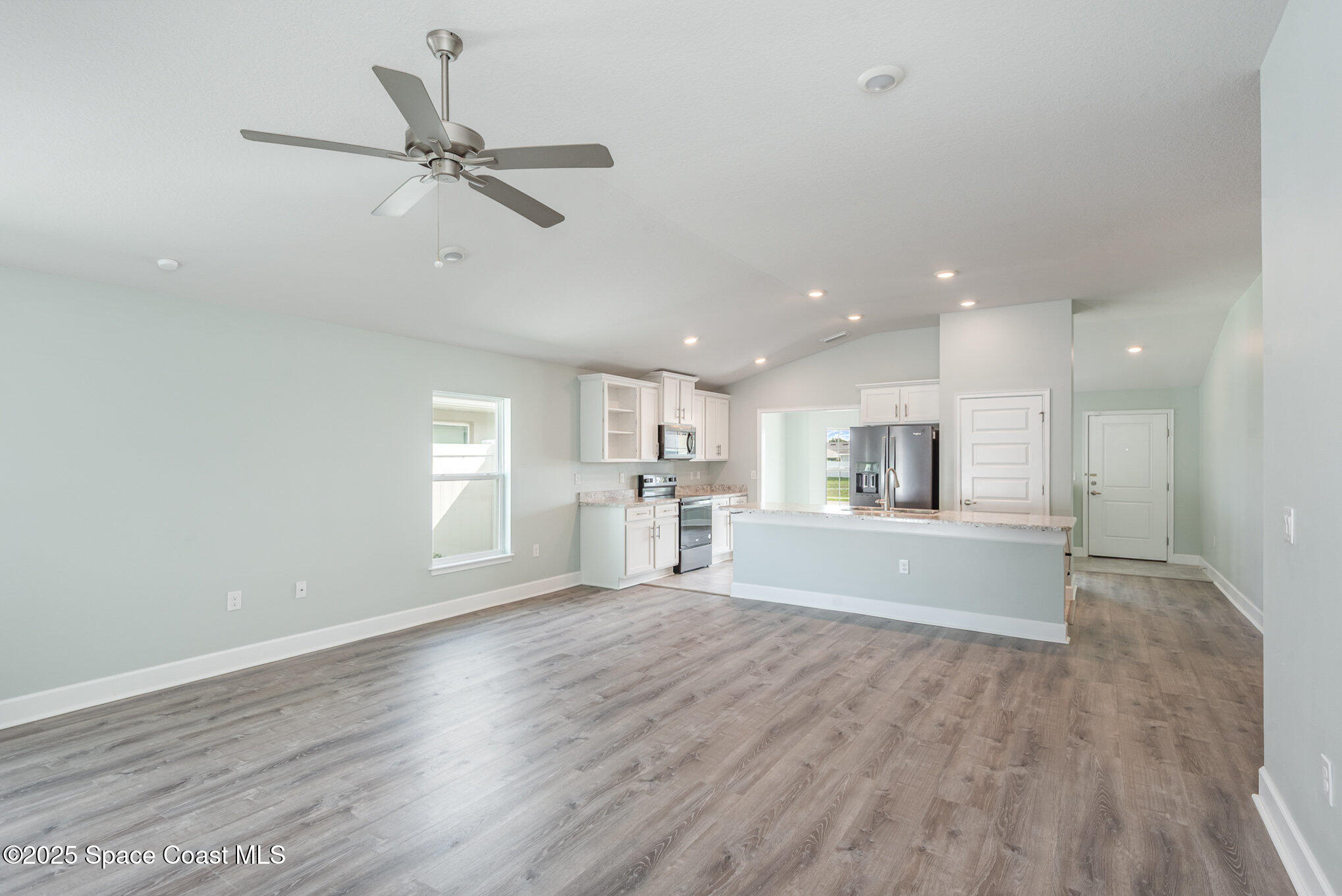 1331 Tupelo Circle Cocoa, FL 32926 - Photo 4 of 29 a view of a kitchen with a sink and a window