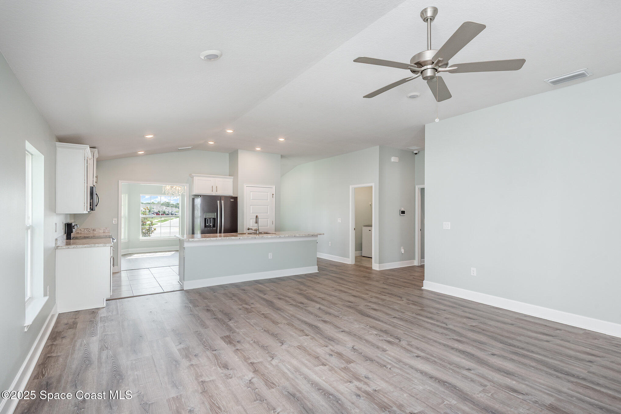 1331 Tupelo Circle Cocoa, FL 32926 - Photo 5 of 29 a view of a kitchen with wooden floor and a window