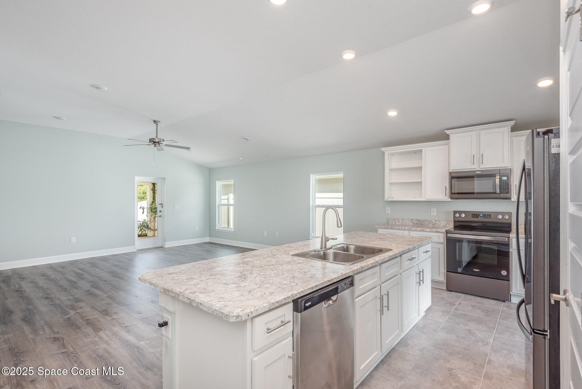 1331 Tupelo Circle Cocoa, FL 32926 - Photo 8 of 29 a kitchen with a sink stove and refrigerator