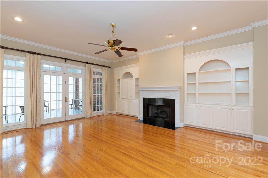 1241 Springlake Road York, SC 29745 - Photo 14 of 48 a view of an empty room with a fireplace and a window