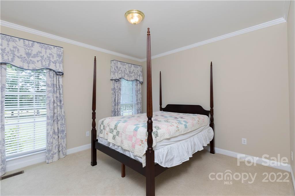 1241 Springlake Road York, SC 29745 - Photo 8 of 48 a bed sitting in a room next to a bathroom