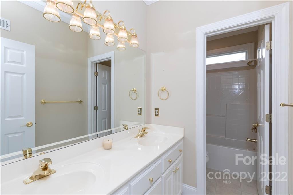 1241 Springlake Road York, SC 29745 - Photo 9 of 48 a bathroom with a sink a vanity and a mirror