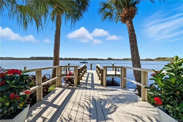 a living room with furniture a dining table and chairs