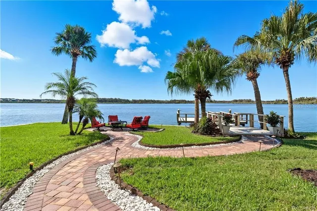 a kitchen with a sink window and cabinets