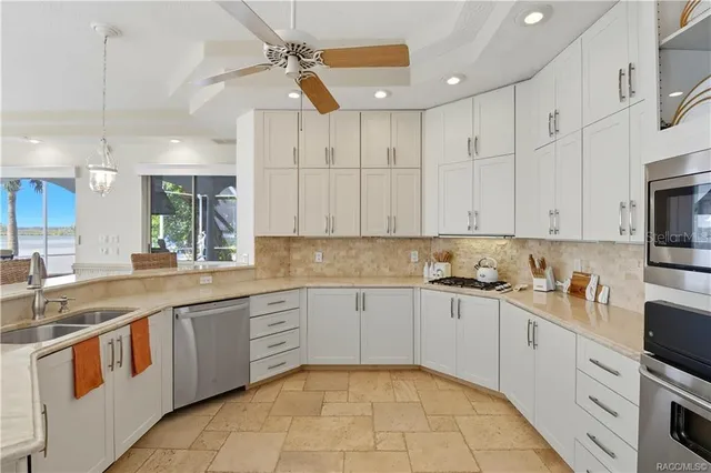 a bathroom with a granite countertop toilet sink and mirror