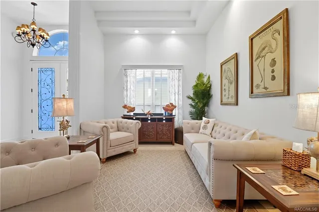 a view of a room with furniture and mirror