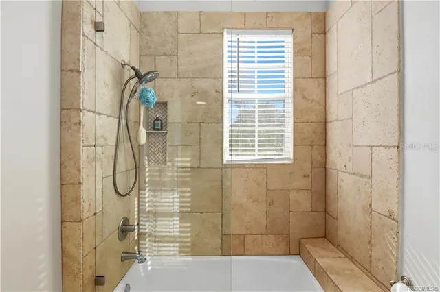 a view of a chairs and table in a backyard