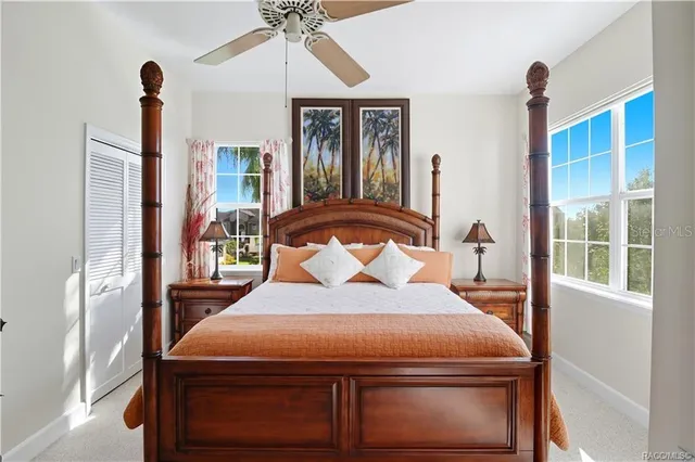 a view of a house with pool and chairs