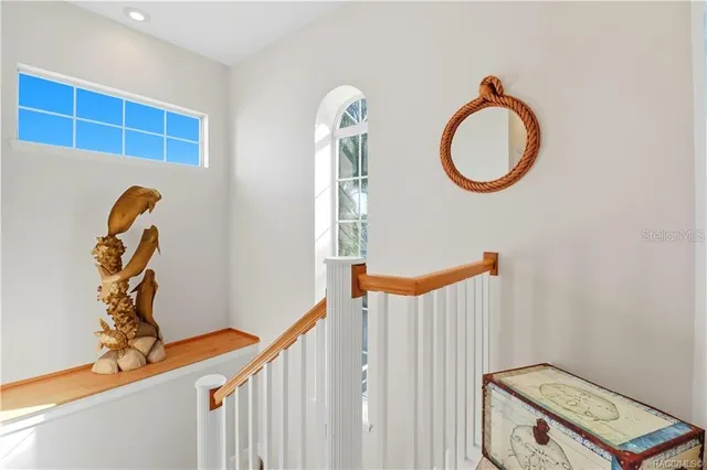 a aerial view of a house with outdoor space and lake view