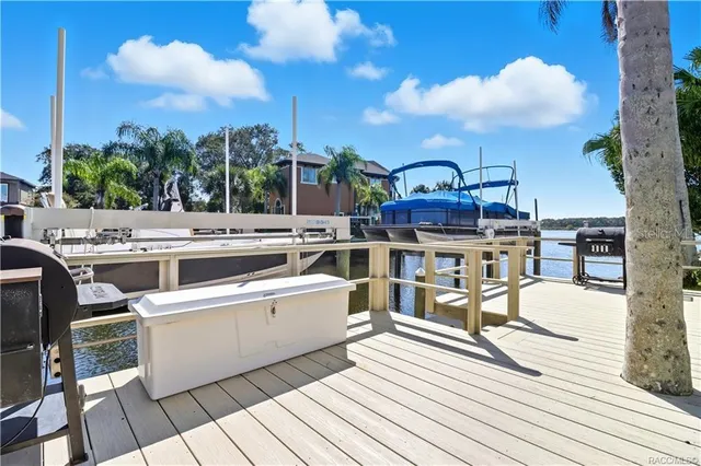 a view of a wooden deck with a yard