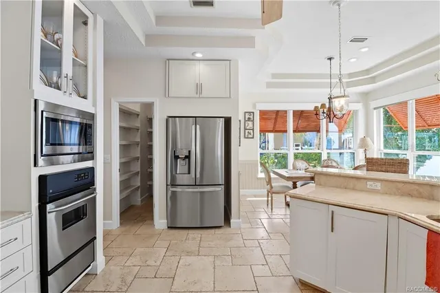 a dining room with furniture a rug and a window