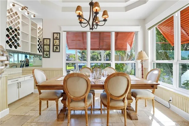 a white toilet sitting next to a bathroom sink and a shower