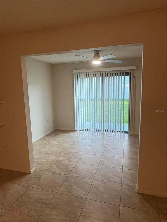 13250 Ridge Road, Unit 16 Largo, FL 33778 - Photo 14 of 36 a view of a livingroom with a floor to ceiling window