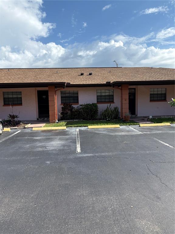 13250 Ridge Road, Unit 16 Largo, FL 33778 - Photo 2 of 36 a view of swimming pool with outdoor seating
