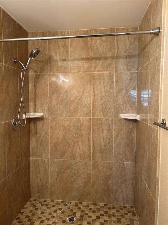 13250 Ridge Road, Unit 16 Largo, FL 33778 - Photo 24 of 36 a bathroom with a shower