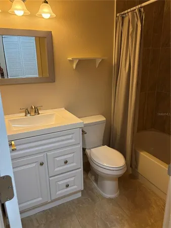 a bathroom with a toilet and a bathtub