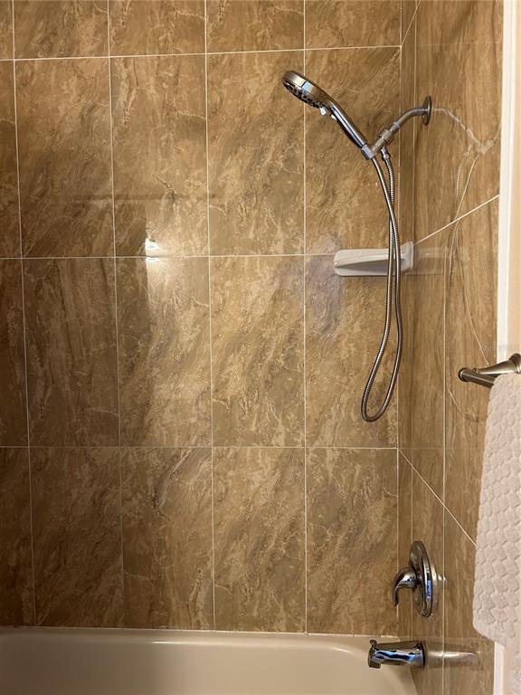 13250 Ridge Road, Unit 16 Largo, FL 33778 - Photo 27 of 36 a bathroom with a shower