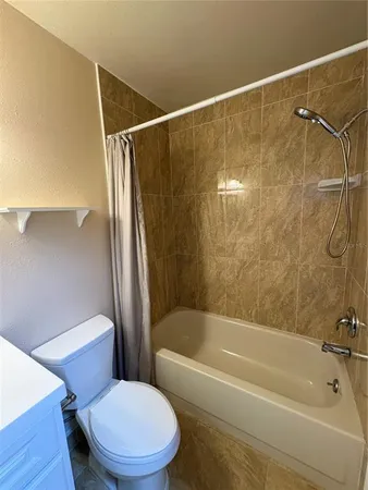 a bathroom with a shower and a bath tub
