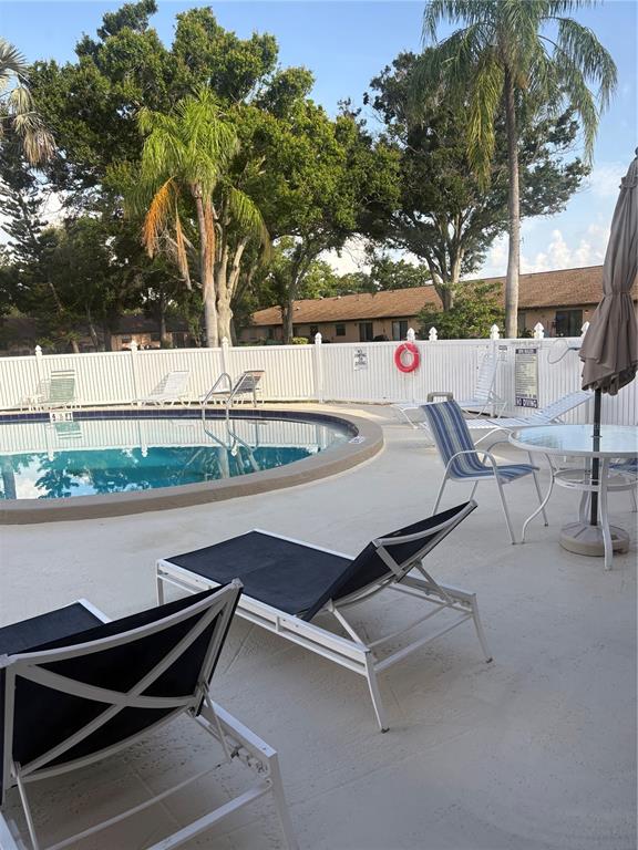 13250 Ridge Road, Unit 16 Largo, FL 33778 - Photo 31 of 36 a view of outdoor space with seating area