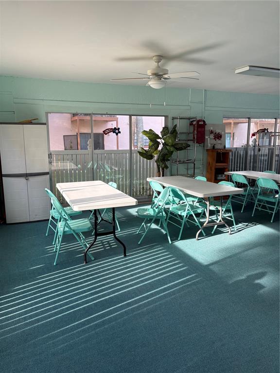 13250 Ridge Road, Unit 16 Largo, FL 33778 - Photo 34 of 36 a view of a patio with a table and chairs